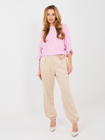 Beżowe dresowe spodnie z miękkiego materiału 