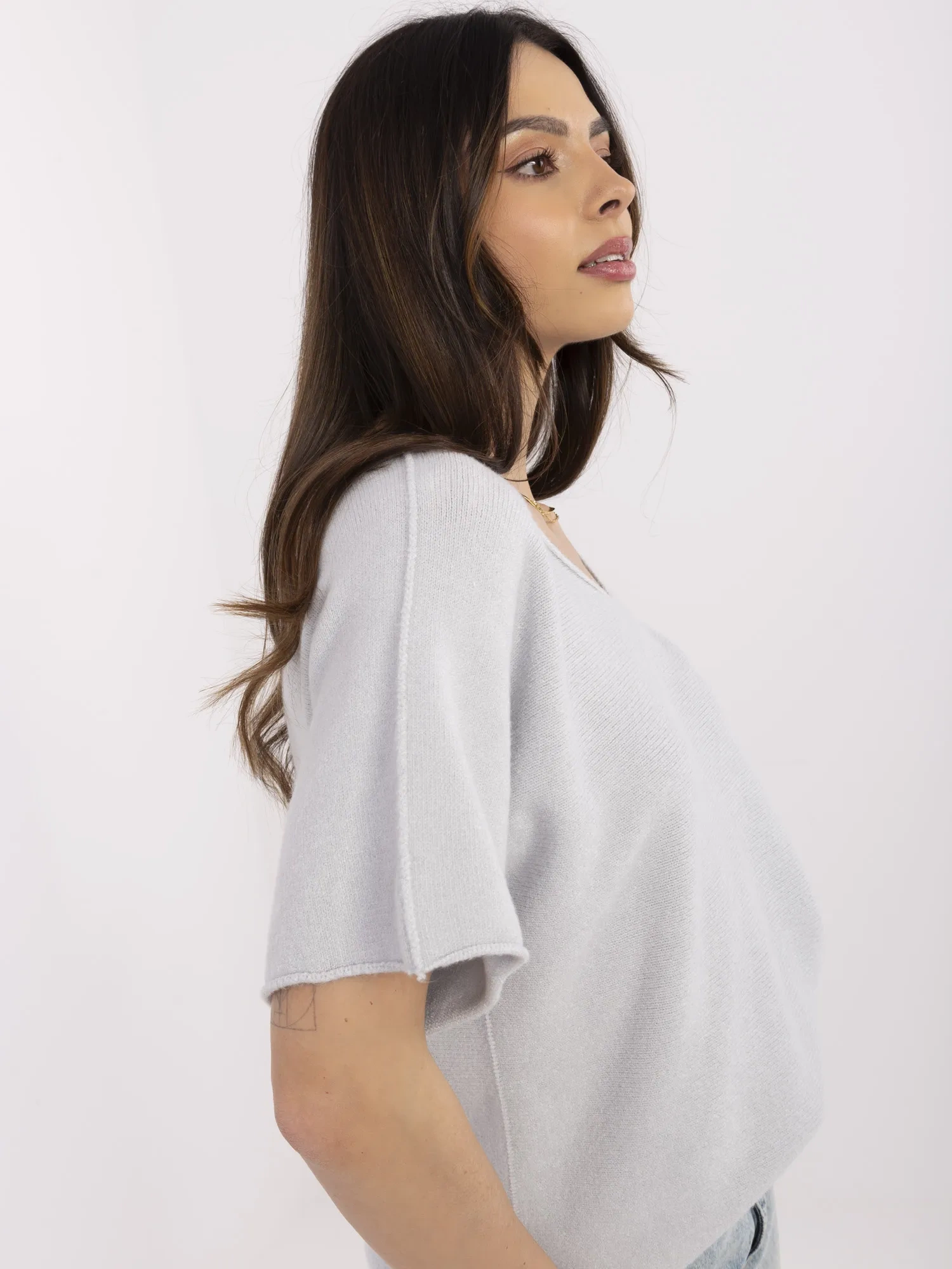Light gray women's basic sweater with short sleeves.