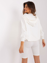 Hurt Ecru three-piece casual set with a sweatshirt and shorts.
