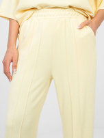Pastelowe żółte spodnie wide leg z wysokim stanem RUE PARIS