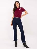 Granatowe jeansy dzwony z postrzępionymi nogawkami