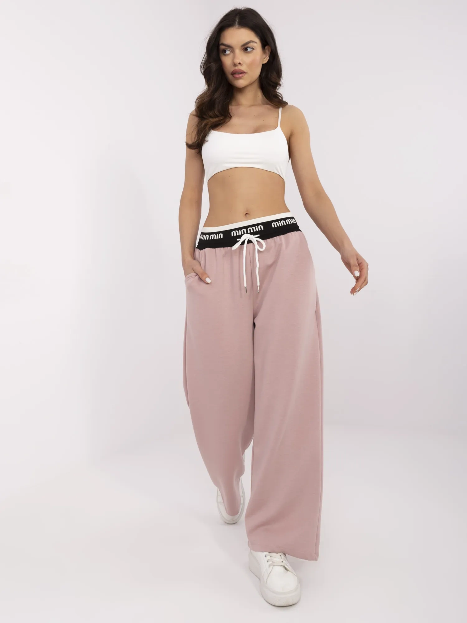 Dirty pink sweatpants with decorative elastic.