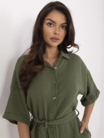 Khaki muslin jumpsuit with a tied belt.