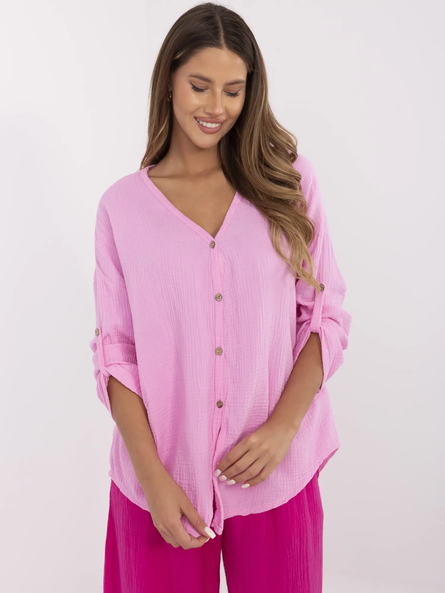 Pink muslin women's shirt with 3/4 sleeves.