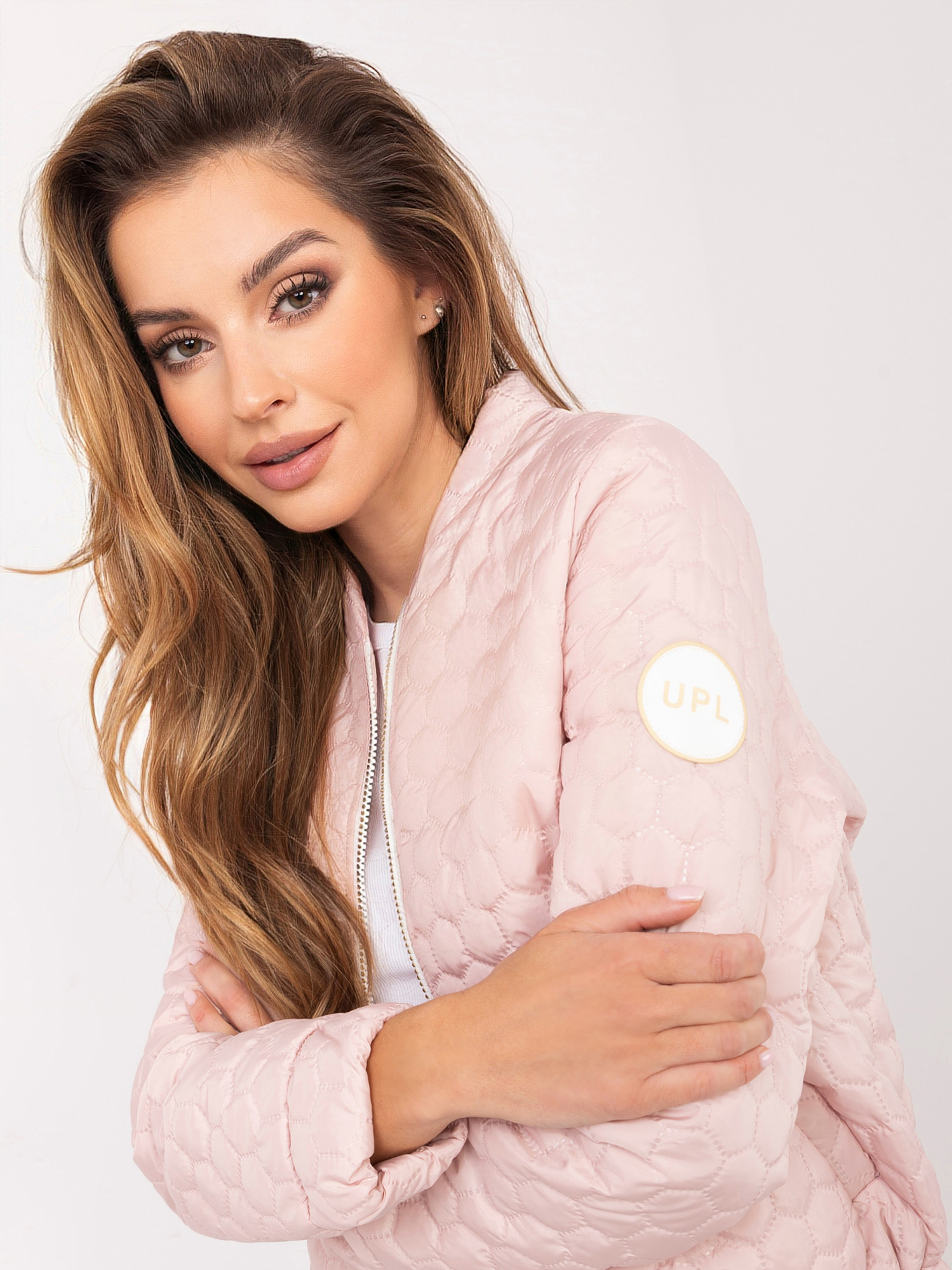 Jasnoróżowa przejściowa kurtka z suwakiem