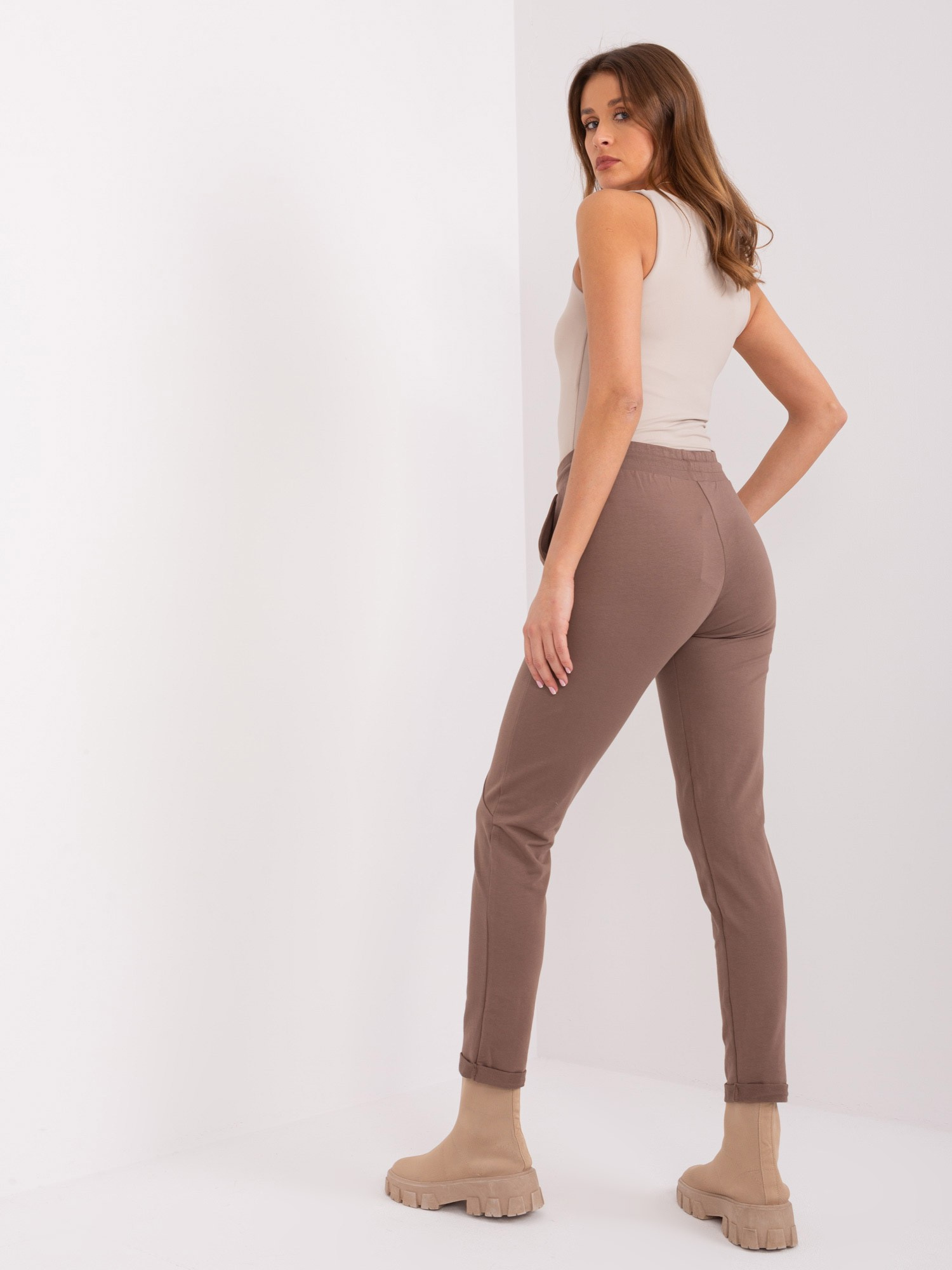 Hurt brown sweatpants with straight legs.