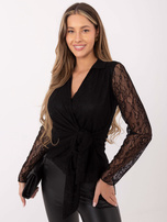 Black lace blouse with a tie.