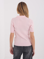 Light pink women's sweater with braids.