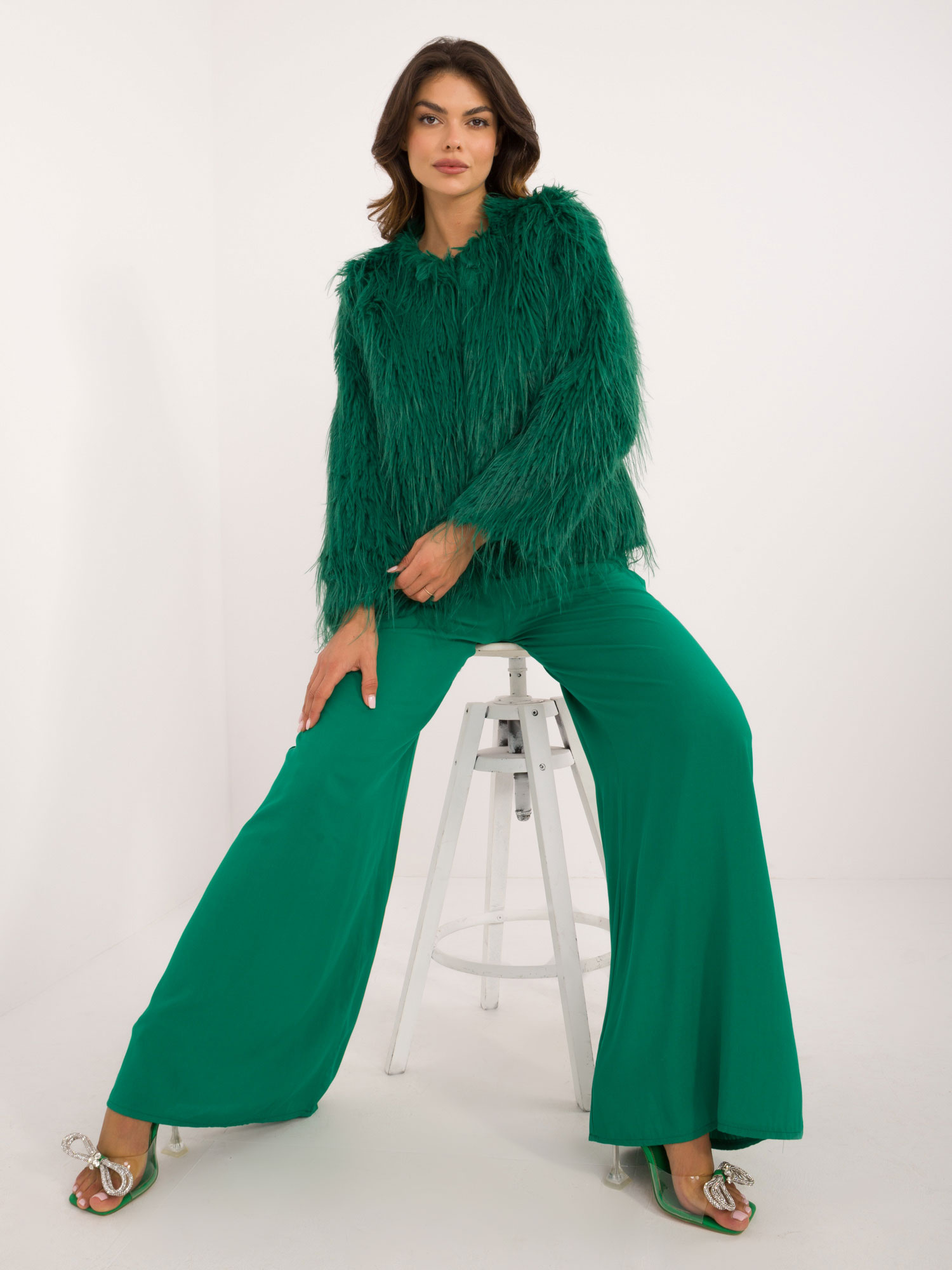 Hurt green women's fur jacket fastened with hooks.
