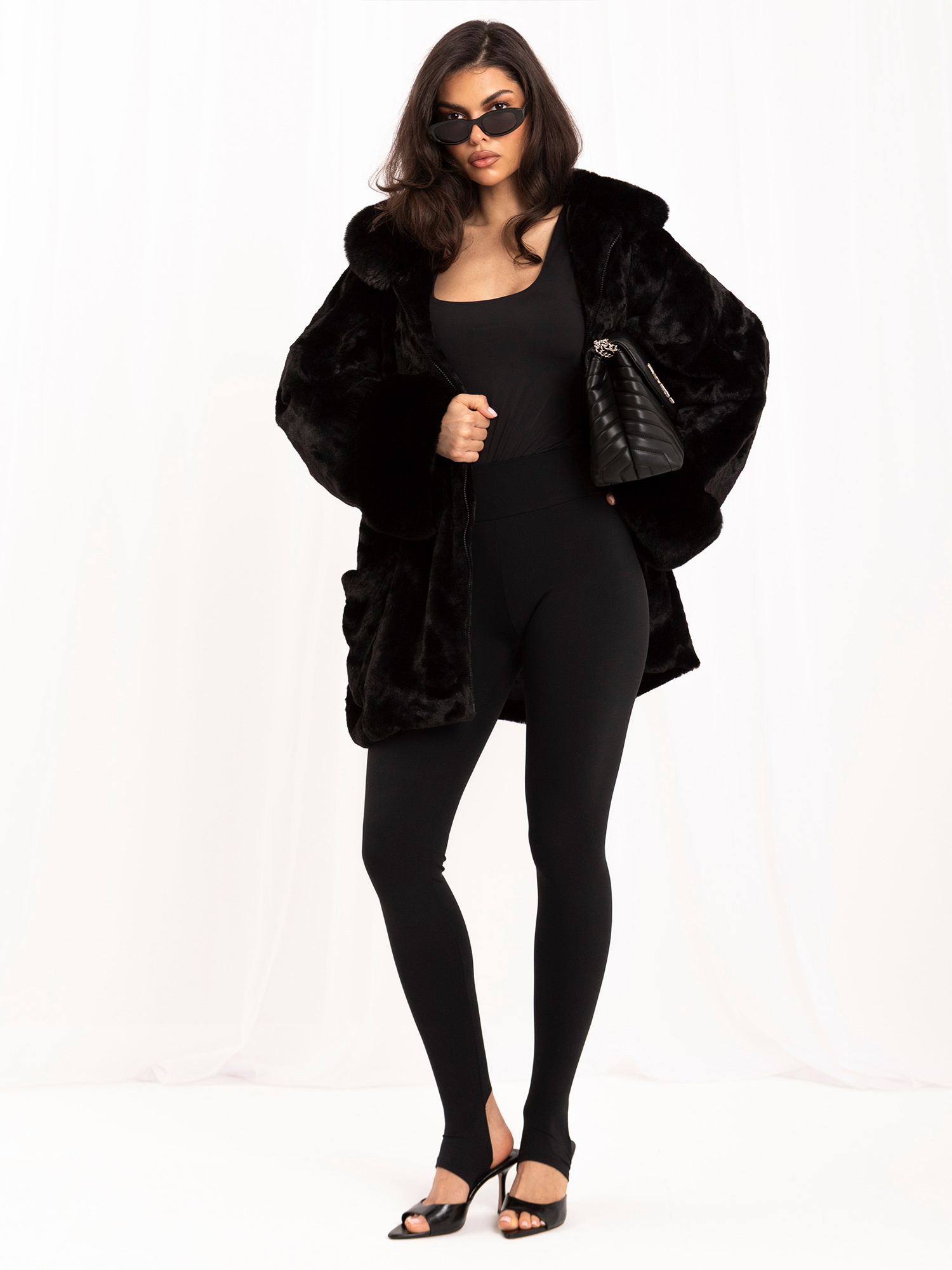 Black women's fur coat with eye-catching sleeves.