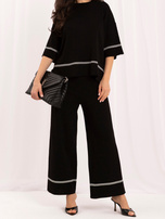 Black knit set with wide trousers.