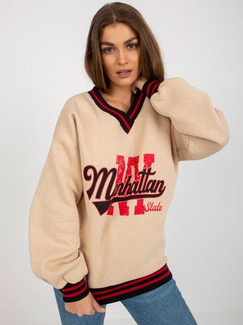Hurt beige Damenpullover mit Aufschriften und V-Ausschnitt.