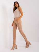 Hurt women's camel sweatpants with stripes.