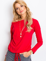 Carla's red blouse.