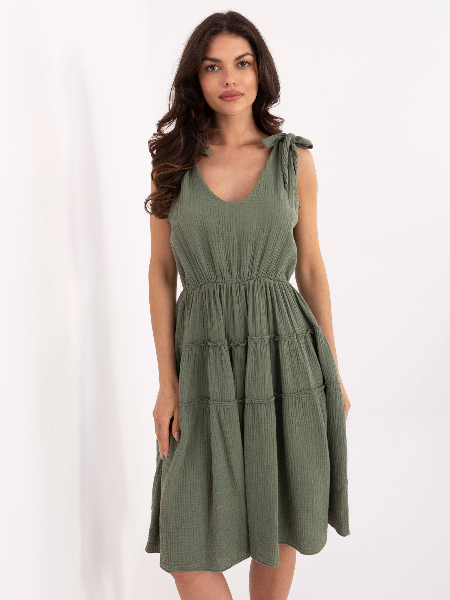 Khaki flared dress made of muslin.