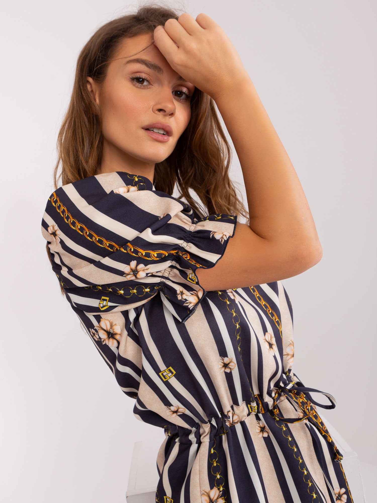 Hurt Navy blue dress with print and puff sleeve.