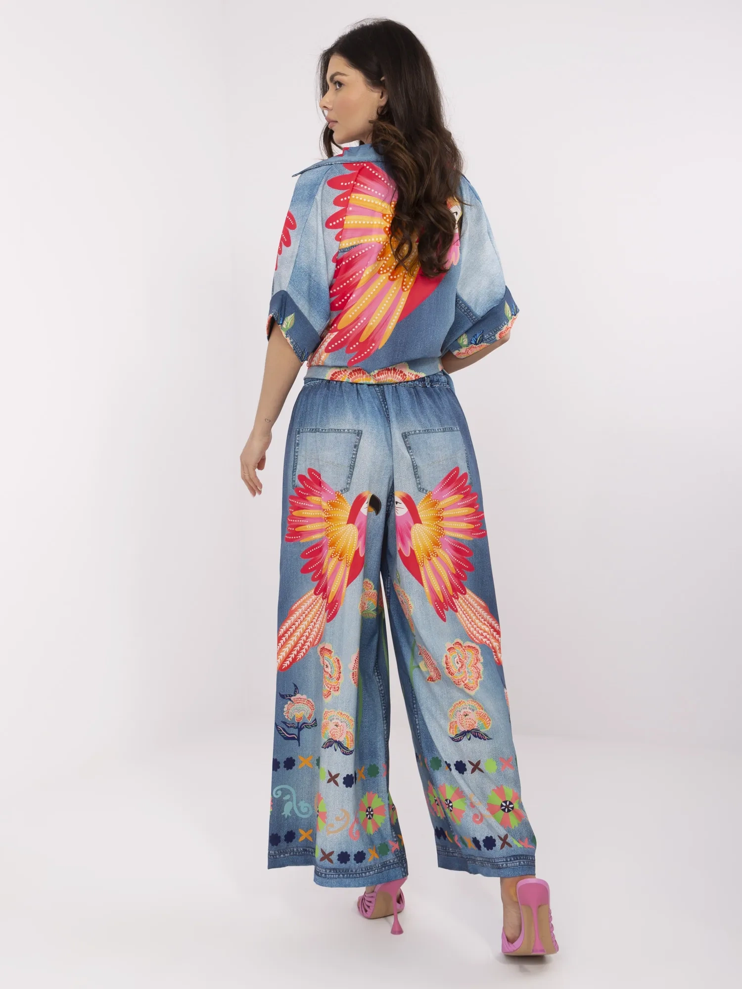 Blue palazzo pants with a colorful print.