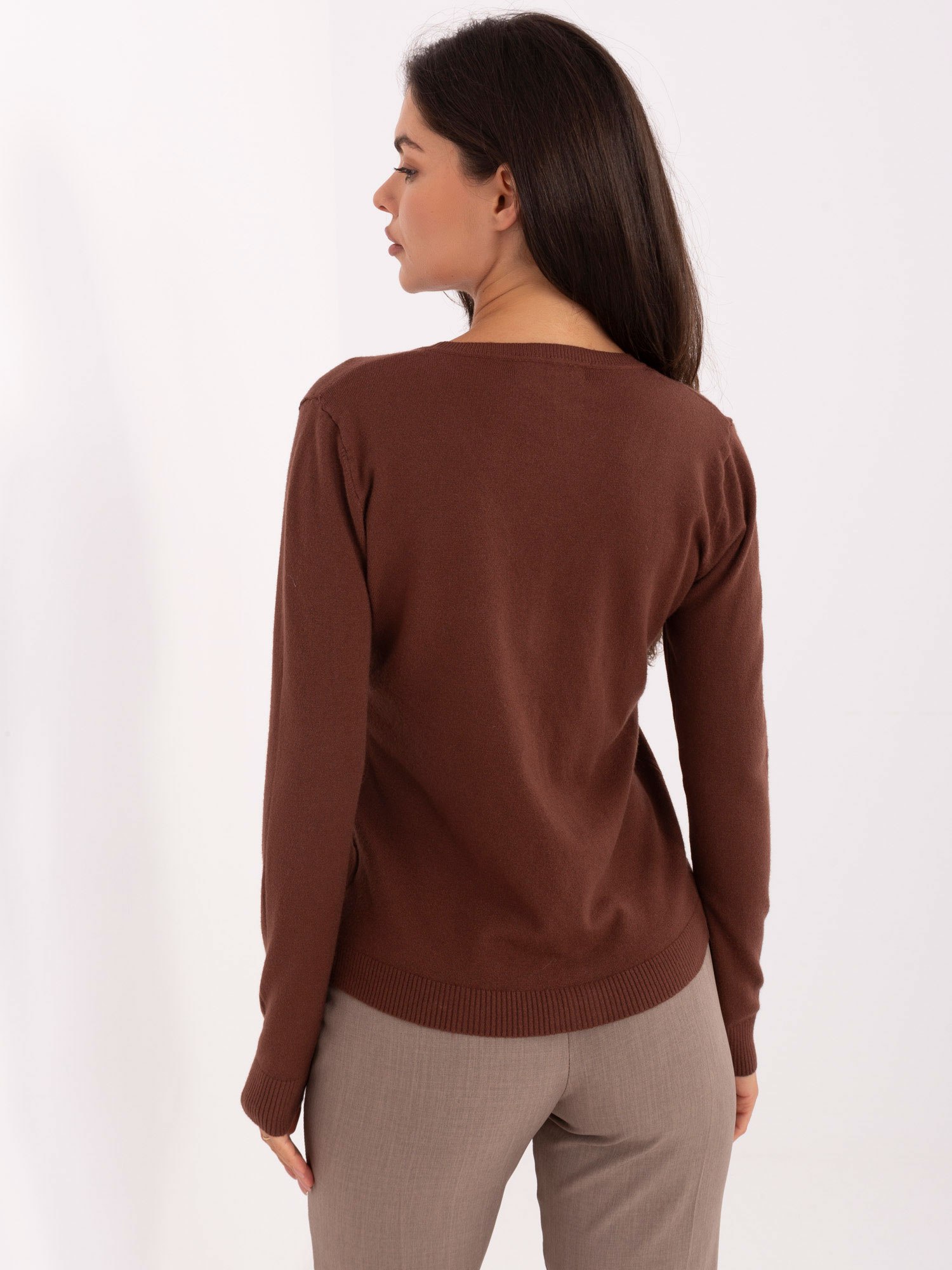Brown short sweater with buttons.