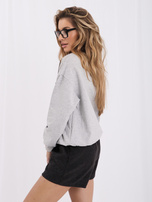 Gray sweatshirt with a bear patch.