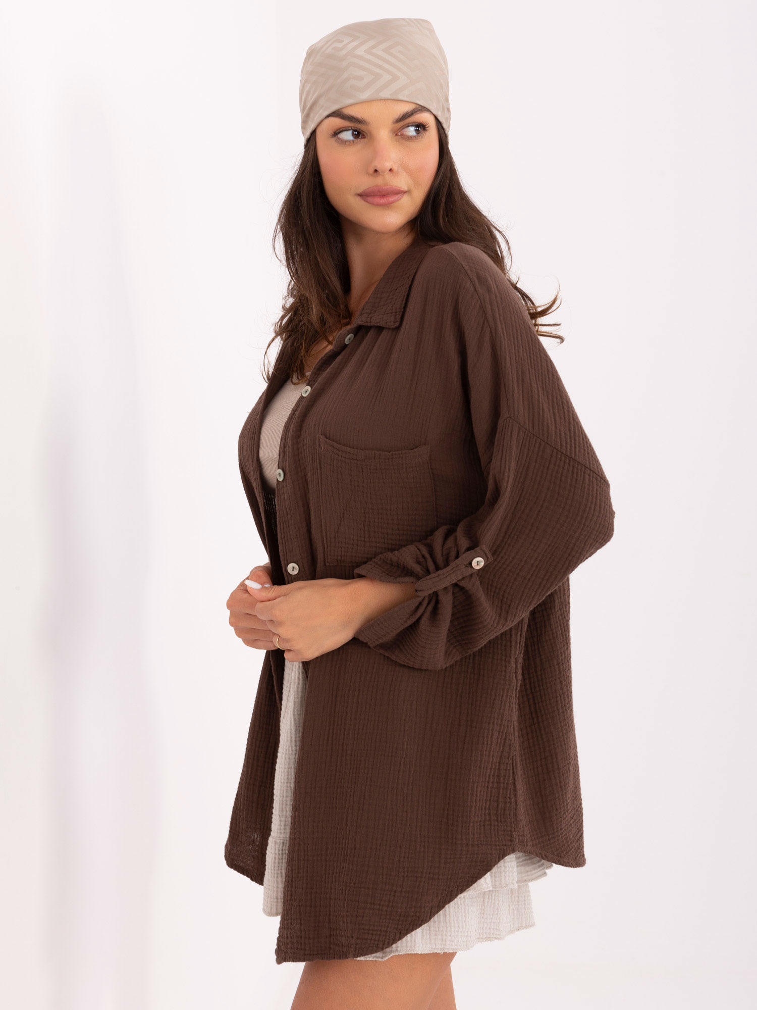 Dark brown oversized muslin shirt.