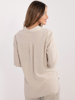 Beige women's shirt with a longer back.