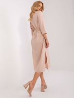 Beige simple everyday dress with a belt.