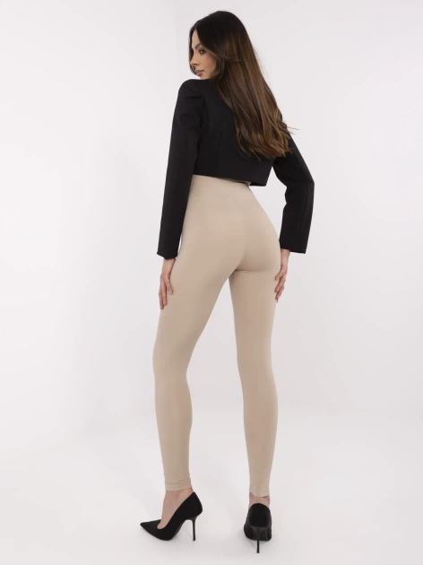 Beżowe damskie legginsy z ozdobną naszywką