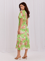 Beige-grüne Midi-Kleid mit bunten Mustern.