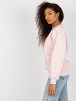 Hurt Jasnoróżowa dresowa bluza oversize z nadrukiem  