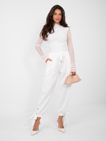 White draped blouse with gathers.