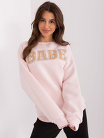Hurtownia Jasnoróżowa bluza bez kaptura z napisem