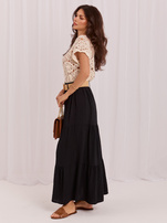 Black layered skirt with a woven belt.