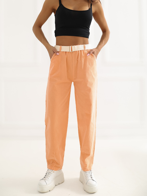 Jasnopomarańczowe sztruksowe spodnie z kieszeniami
