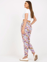 Biało-fioletowe letnie spodnie z materiału we wzory SUBLEVEL