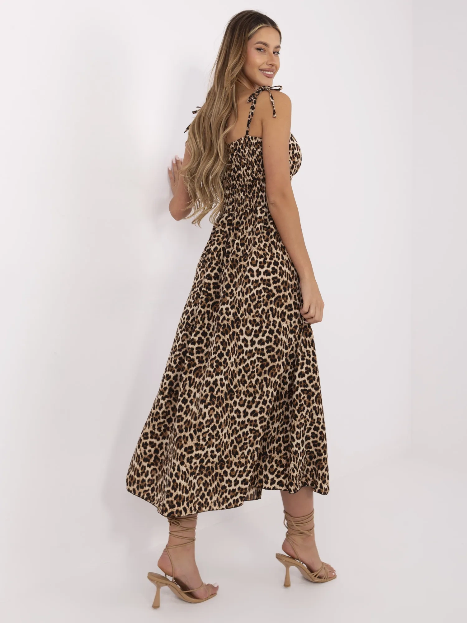Beige and black long dress with leopard print.