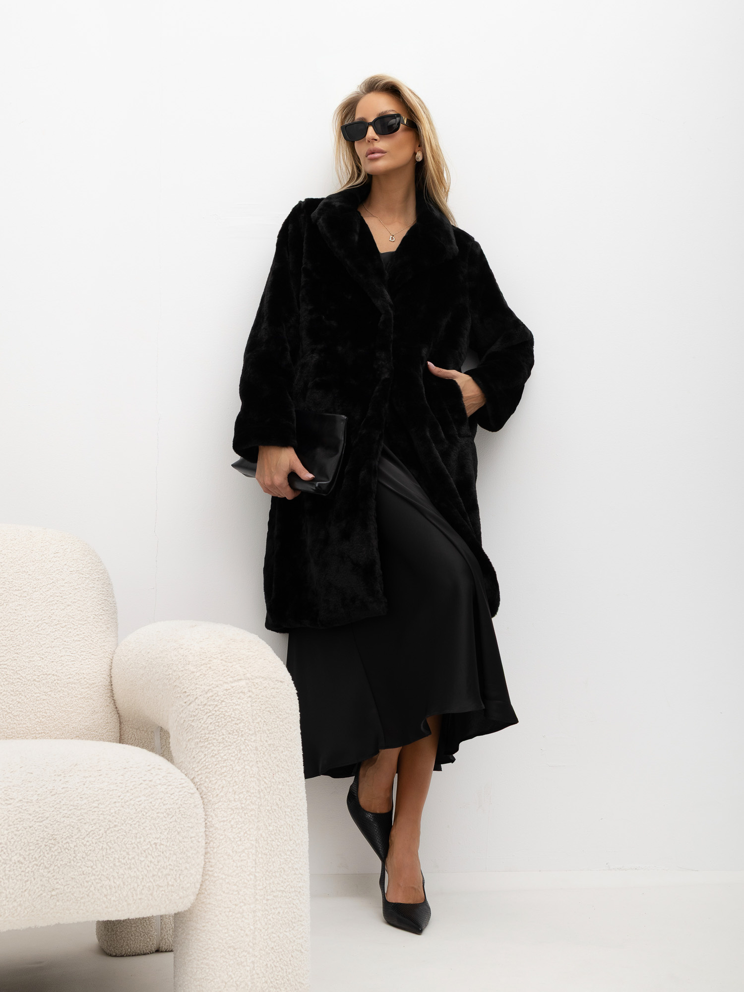 Black fur midi coat with pockets.