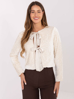 Jasnobeżowa krótka narzutka z cekinami