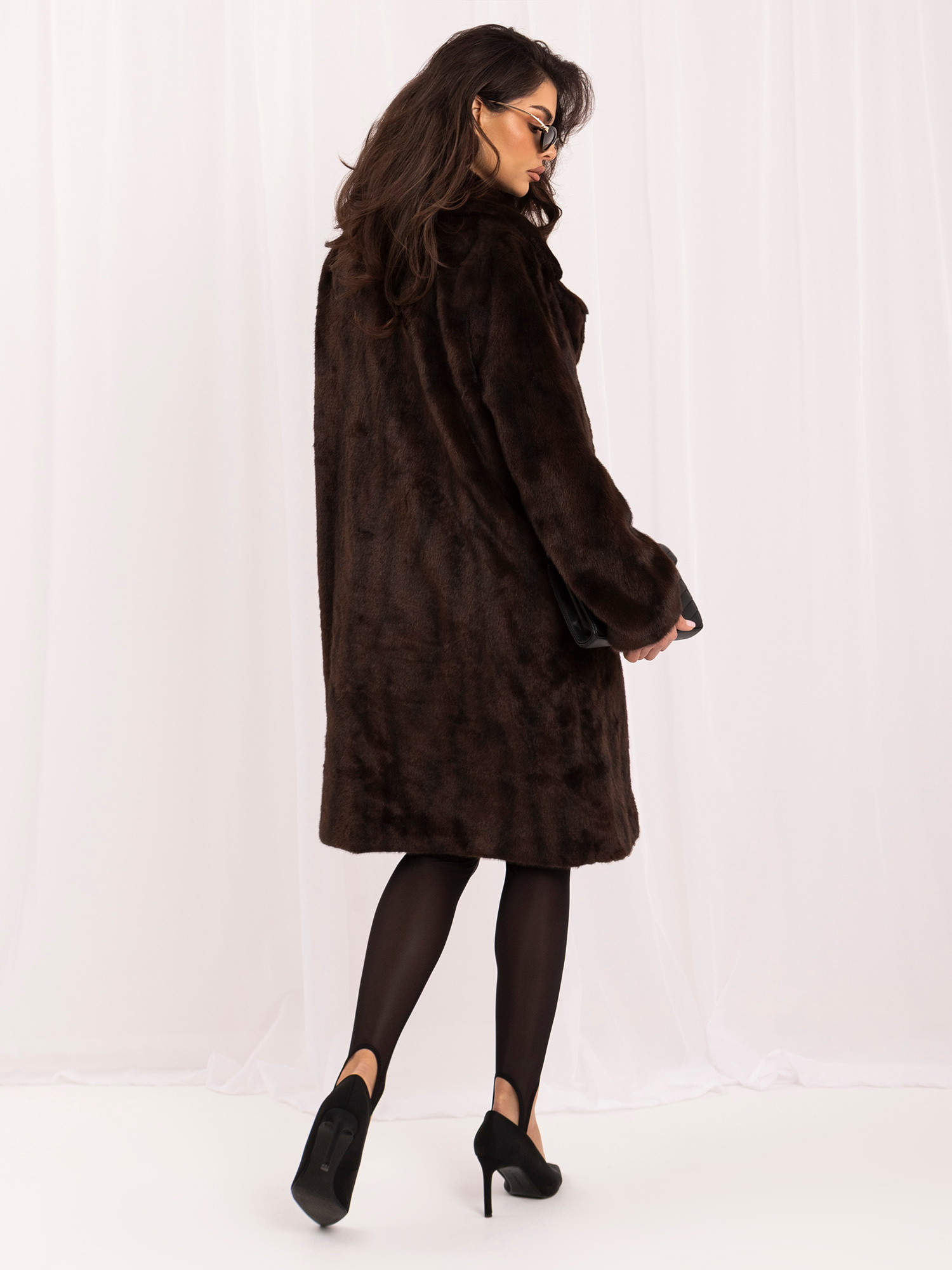 Brown fur coat with double-breasted fastening.