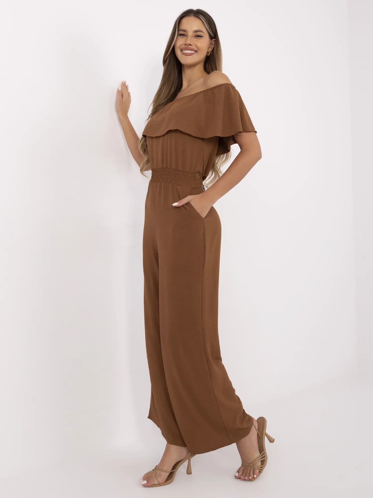 Light brown long jumpsuit with pockets.
