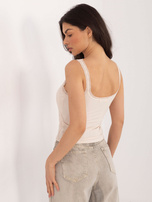 Jasnobeżowy krótki top z koronką 