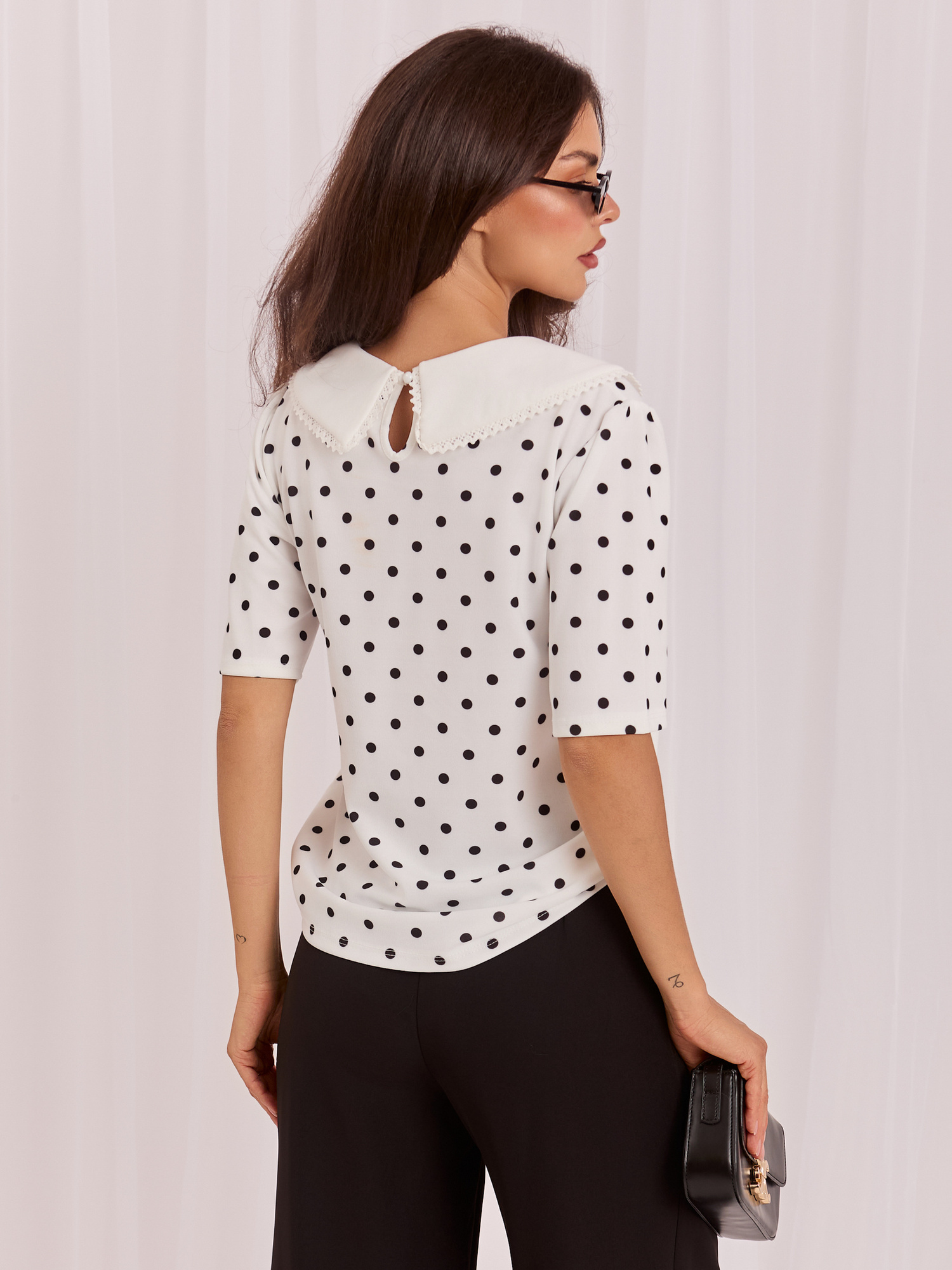 White elegant polka dot blouse.