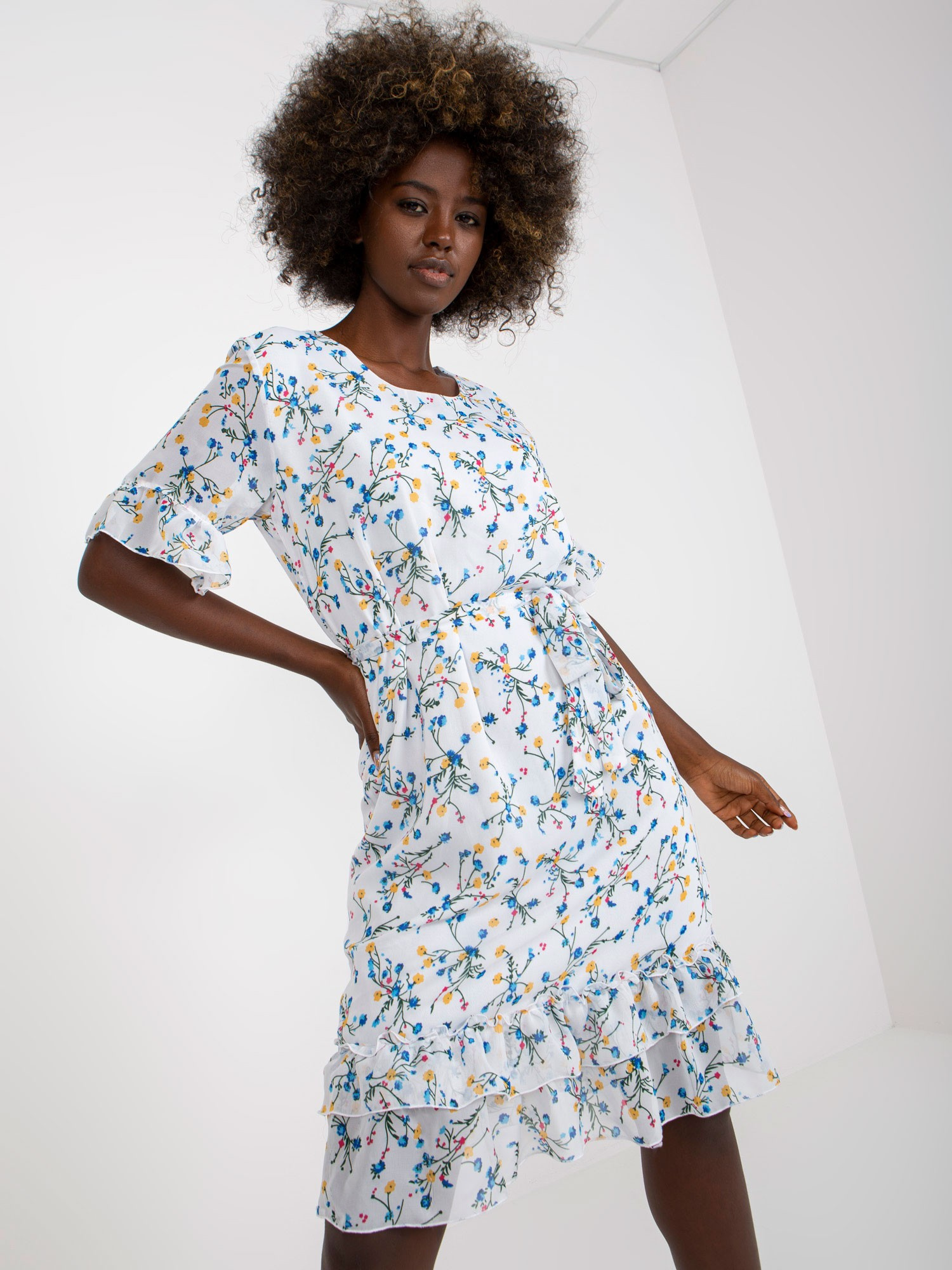 White midi dress with floral pattern and flounces