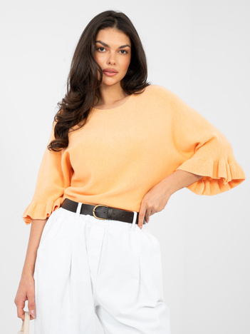 Pastelowy pomarańczowy sweter z jednolitym kolorze