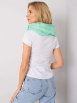 Zielony komin z błyszczącą aplikacją