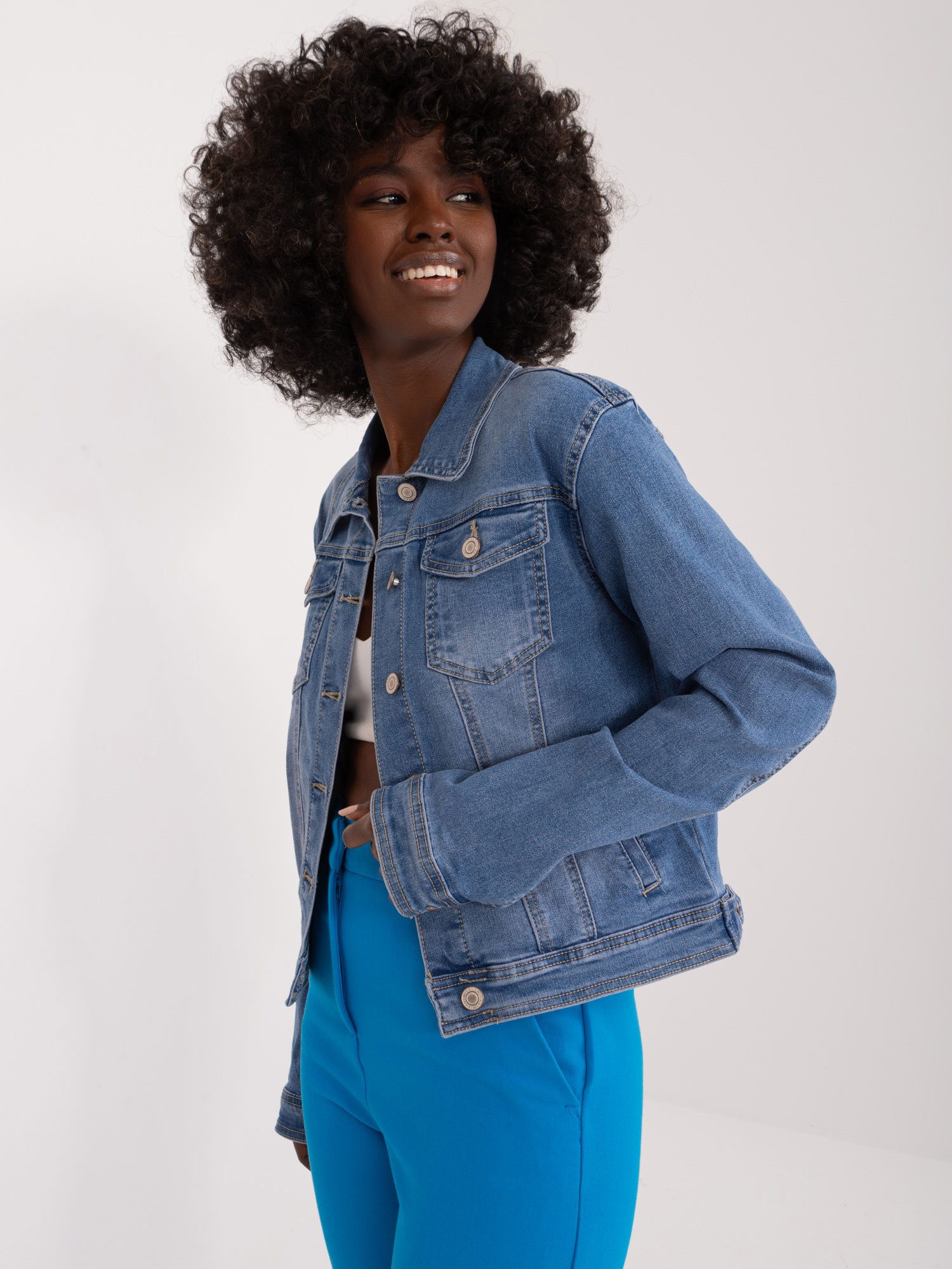 Wholesale Blue denim jacket with buttons.