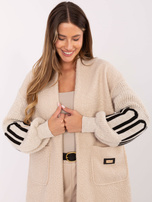 Light beige boucle cardigan with puff sleeves.