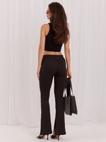 Großhandel Schwarze gestreifte Leggings mit Schlitzen.
