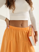 Jasnopomarańczowe sztruksowe spodnie z nogawką 7/8