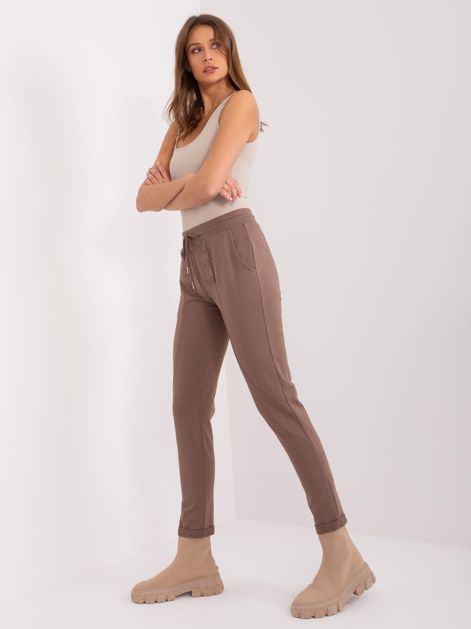 Hurt brown sweatpants with straight legs.