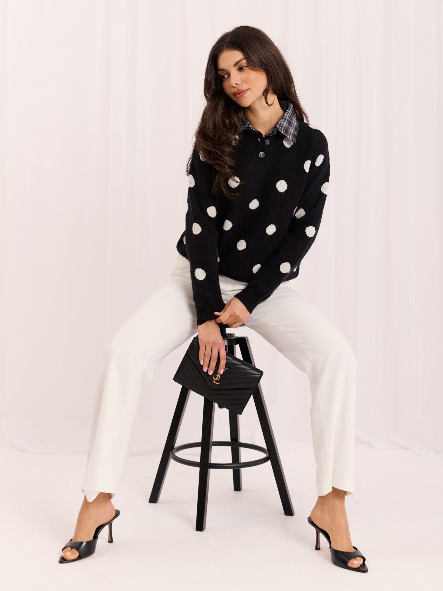 Black women's oversized polka dot sweater.